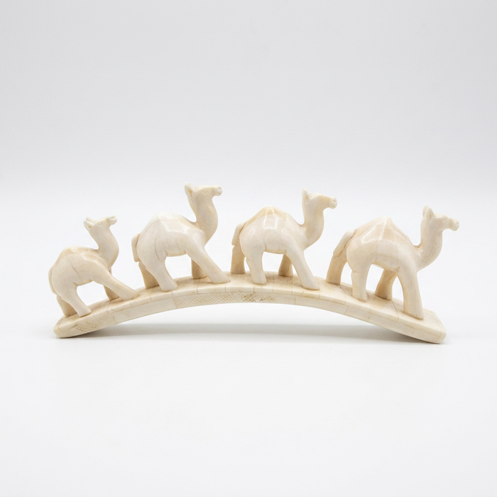 Camel Bone Caravan Sculpture — Four Camels in Procession on Arched Base