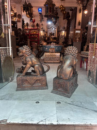 Bronze Fu Dog Guardian Lions — Pair of Foo Dogs on Carved Pedestal in Dark Patina