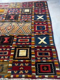 Handknotted Wool Tribal Rug — Polychrome Patchwork Field with X & Diamond Motifs